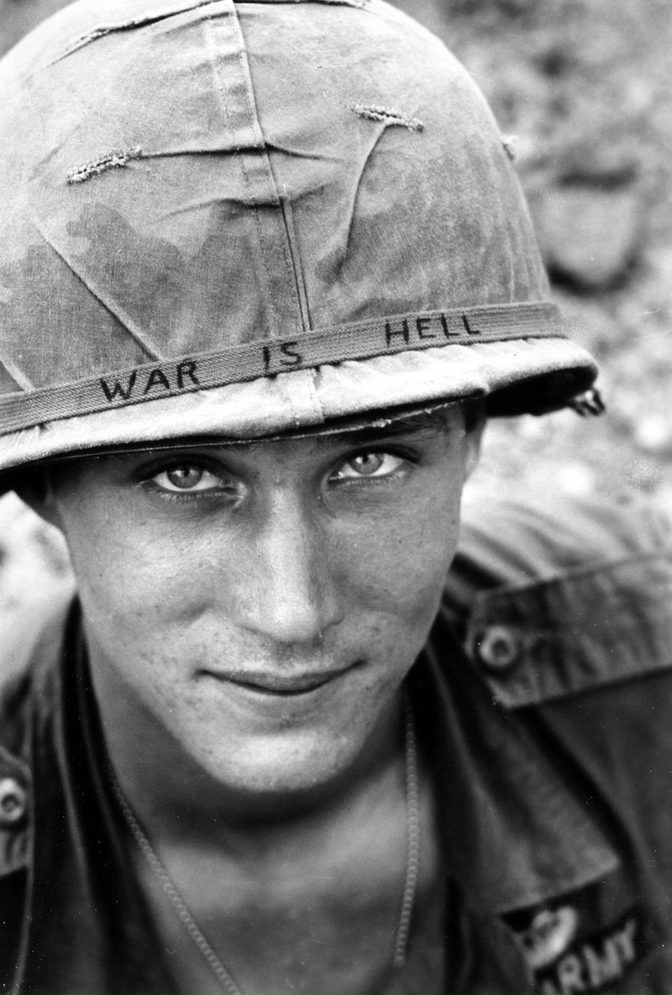An American soldier wears a hand lettered War Is Hell slogan on his helmet, Vietnam, 1965.jpg